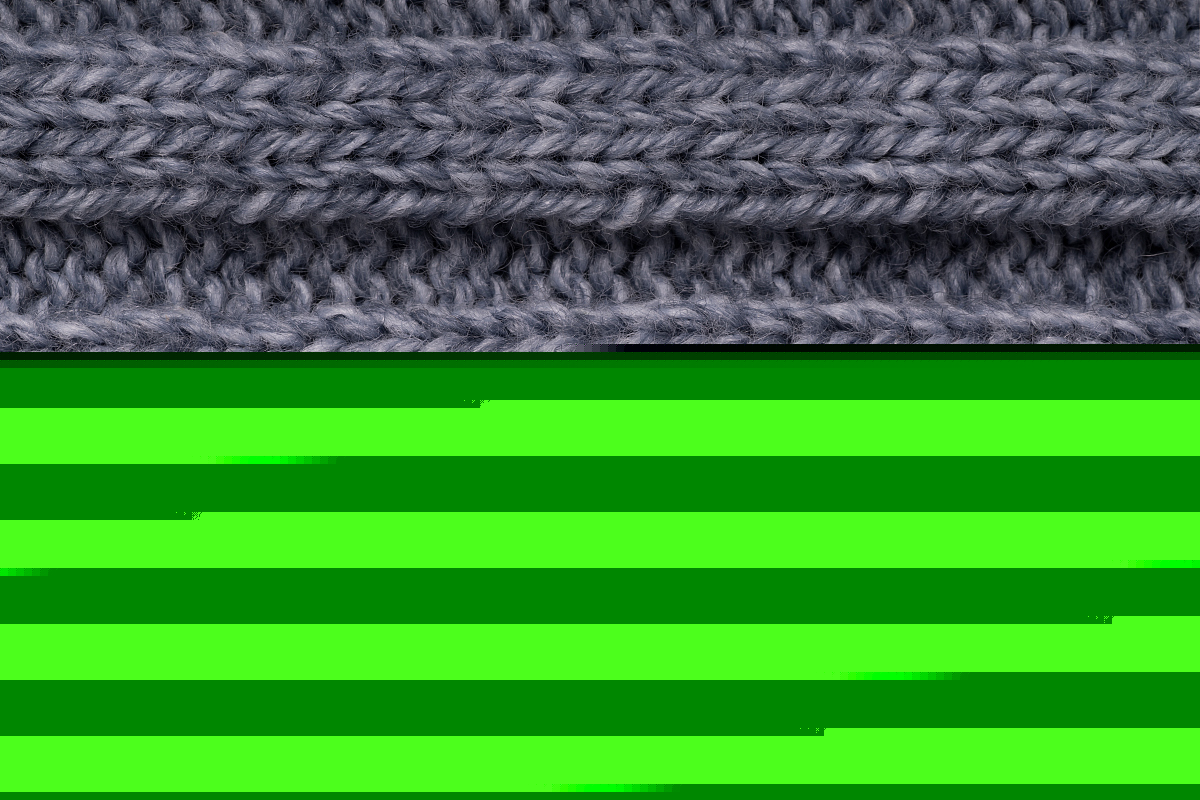 灰色針織毛織品的紋理。背景