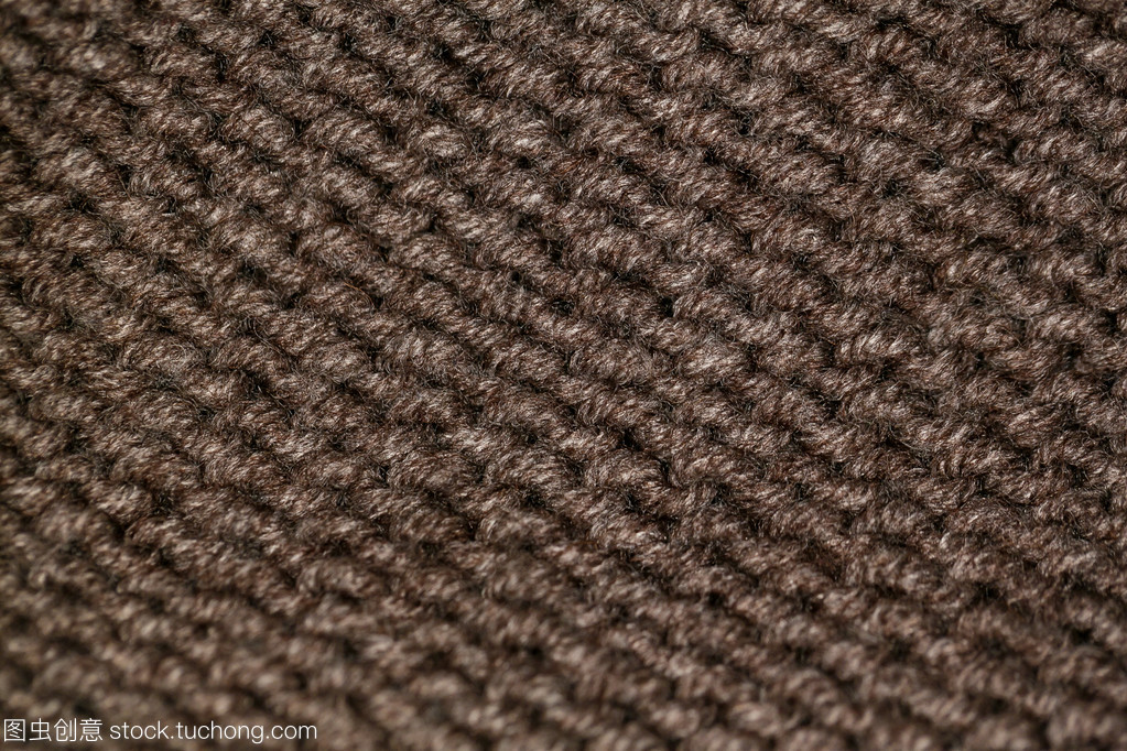從背景的米色礦石棕色羊毛溫暖軟紗織